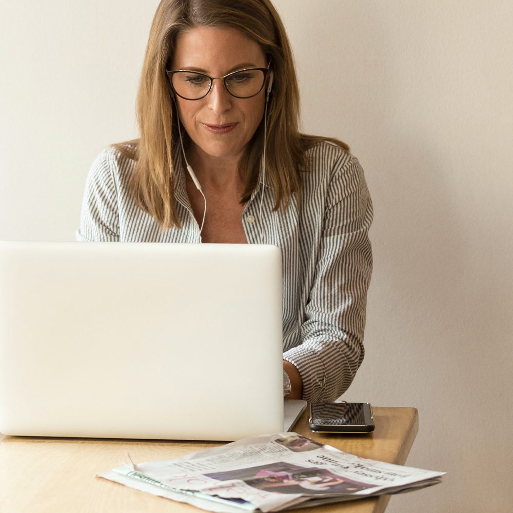 Swift Disability Services Home woman working on her laptop