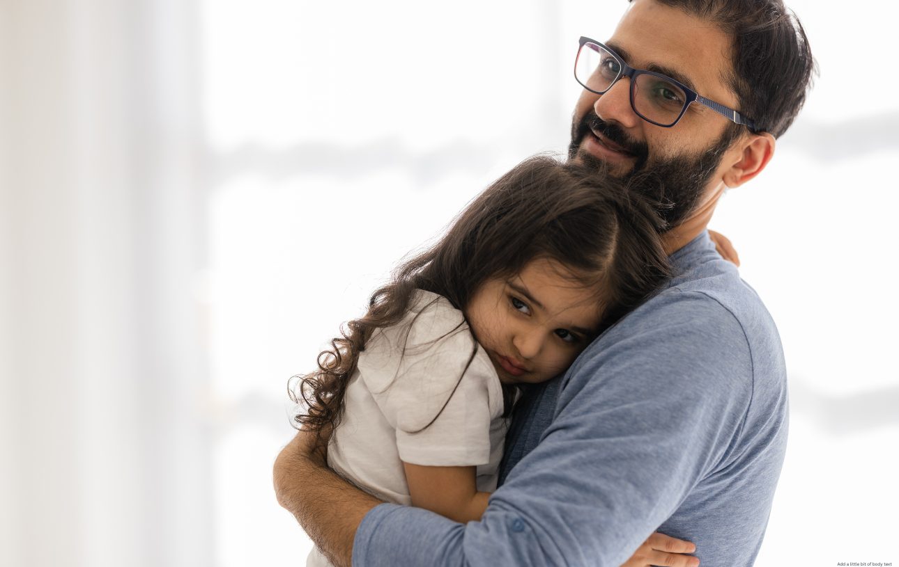 man comforting his daughter